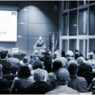 People listening to a symposium